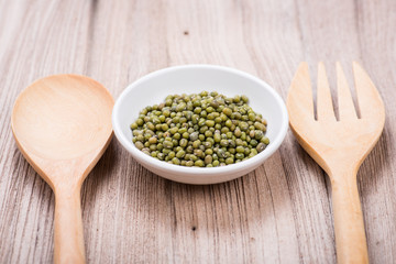 Green mung beans in ceramic bowl