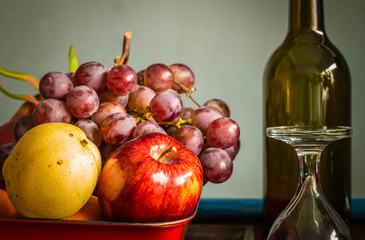 fruits and a glass of wine.