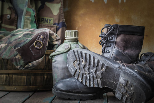 boots of soldiers on wooden