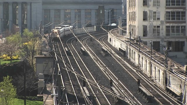 One of Chicago's famed Ls rounds a corner and heads down the elevated tracks past nondescript buildings.