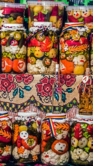 Fototapeta premium Various types of pickles which symbolizes happy faces, prepared in large jars. Specific to the area Maramures, Romania.
