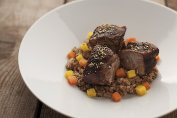 Pork belly on buckwheat risotto with carrots