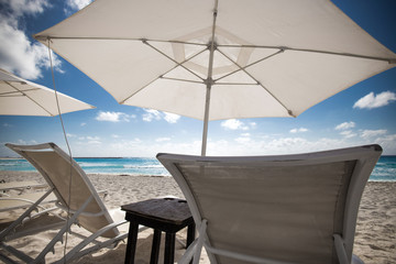 Beach with sun umbrellas and beds