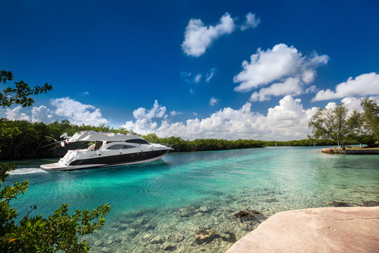 Fototapeta Luxury  motor yacht sailing out at sea