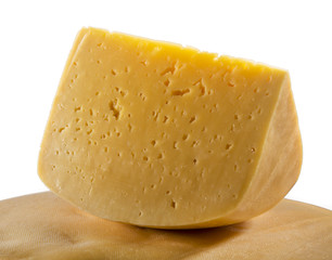 triangular piece of cheese on white background