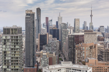 Cluster of high-rise buildings in Downtown Toronto on the background of Toronto sky.