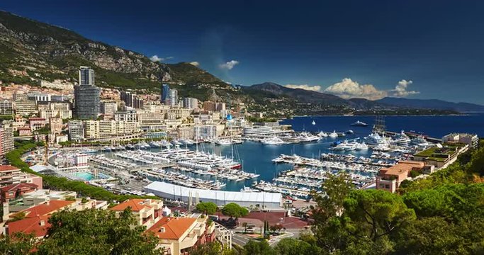Monaco, Monte-Carlo, 07.09.2015: Port Hercules, port de Hercule, luxury yachts, big boat, view from Princes Palace of Monaco, yacht show, mediterranean sea, time-lapse 4k video