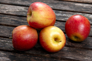 Beautiful Red Apples on wooden table. background, texture