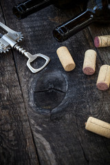 Fototapeta na wymiar Bottle of wine, corks and corkscrew