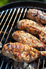 Grilled chicken breast on barbeque