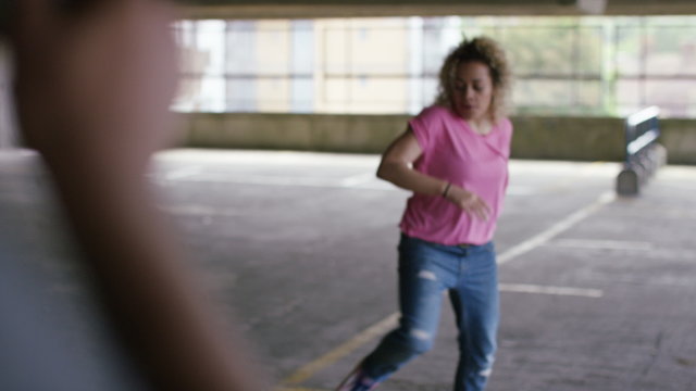 4K Attractive female breakdancer dancing whilst being recorded on a smart phone, shot on Red Epic Dragon