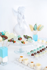 Variety of fruits covered with a color chocolate