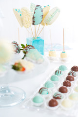 Variety of fruits covered with a color chocolate