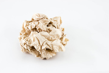 Curly piece of brown paper on white background