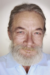 close-up adult old man with gray hair smiles