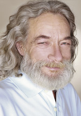 close-up adult old man with gray hair smiles