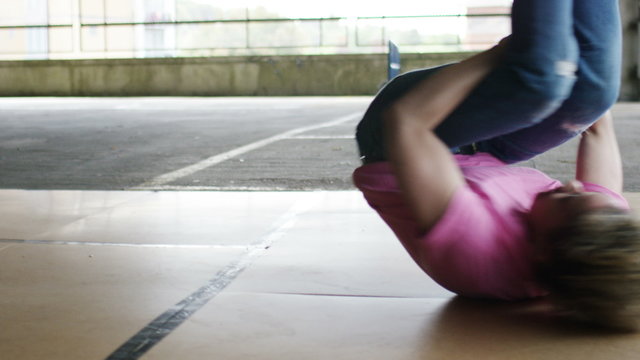 4K Female breakdancer spins on her back and does a handstand, shot on Red Epic Dragon