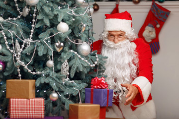 Santa Claus holding present