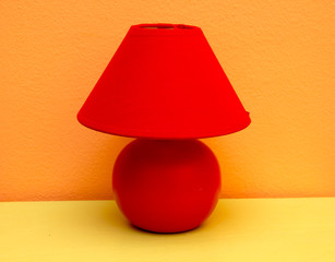 Table lamp on a red table yellow