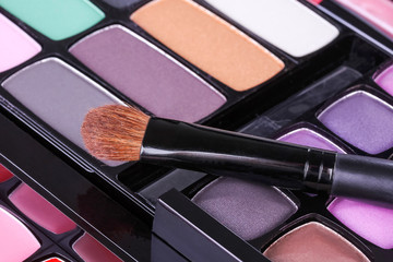 Make-up eye shadows palette with makeup brush