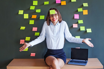 forgetful caucasian woman covered with paper stickers