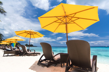 Sun umbrella and beach beds on  beach