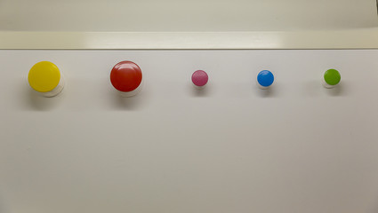 Round colorful hangers on magnets