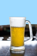 Glass of beer on table