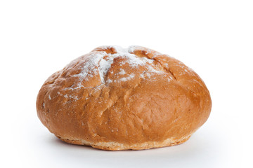 Homemade whole round bread sprinkled with flour
