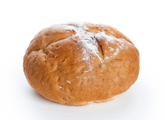 Homemade whole round bread sprinkled with flour