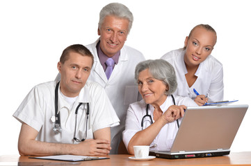 Group of doctors with laptop