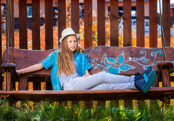 Girl on garden swing 1