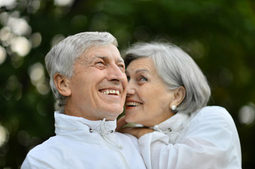 Mature couple on  walk  in summer