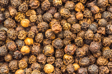 Macro Image of Whole Black Peppercorns