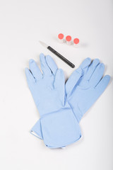Gloves with scalpel and test tubes