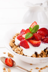 Yogurt with homemade granola and fresh strawberry