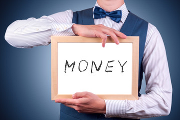 a man with a sign in his hands with an inscription money