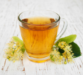 Cup of herbal tea with linden flowers