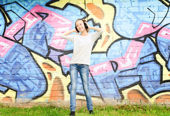 girl on the street on a red wall