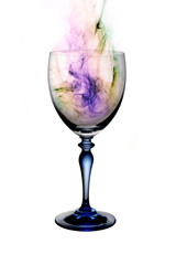 brandy cognac glass with colorful  smoke