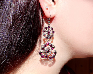 earrings jewellery with bright crystals in ear