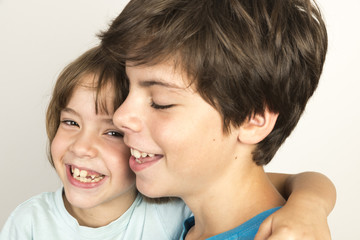 Children hugging and smiling