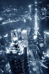 Bird view at Shanghai China. Skyscraper under construction in foreground. Fog, overcast sky and pollution. Bund (Pudong) area