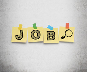 Yellow stickers are on the concrete wall with the word JOB as a symbol of the searching of the vacancies in the Internet.
