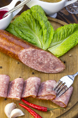 sausage on a wooden plate in a restaurant