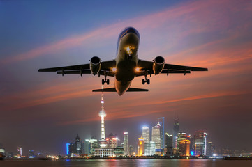 airplane, background of the shanghai skyline
