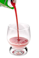 pouring a glass of tomato juice