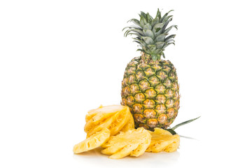 Fresh juicy nutritious cut pineapple with whole fruit as background