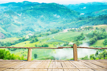 Fototapeta premium Bamboo terrace with view of blurry mountain view on the Northern of Thailand, Chiangrai province.