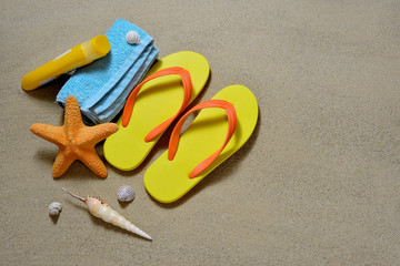 Fototapeta na wymiar Beach accessories and seashells on sandy beach